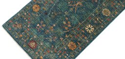 Backside of handmade New Farahan rug showing knot structure and weave density