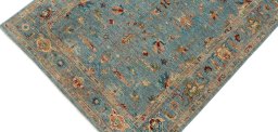 Backside of handmade New Farahan rug showing knot structure and weave density