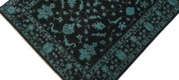 Backside of handmade New Farahan rug showing knot structure and weave density