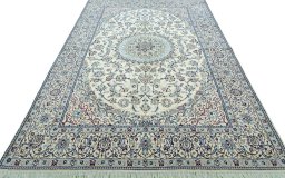 Surface texture of 2000s Nain rug with natural Wool and intricate pattern