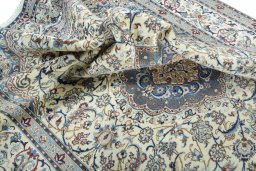 Surface texture of 2000s Nain rug with natural Wool and intricate pattern