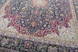 Close-up detail of 1970s Kerman rug from Iran / Persia showing Wool weave