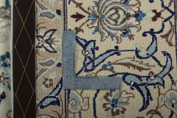 Backside of handmade New Nain rug showing knot structure and weave density