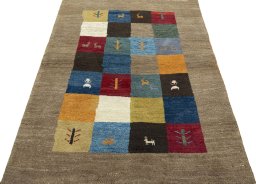 Surface texture of 2000s Persian Gabbeh rug with natural Wool and intricate pattern