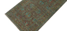 Backside of handmade New Farahan rug showing knot structure and weave density
