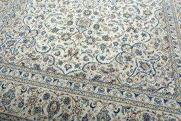 Close-up detail of 2000s Kashan rug from Iran / Persia showing Wool weave