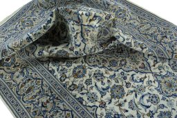 Surface texture of 2000s Kashan rug with natural Wool and intricate pattern