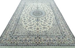 Surface texture of 2000s Nain rug with natural Wool and intricate pattern