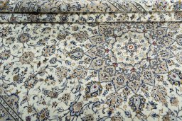 Close-up detail of 2000s Kashan rug from Iran / Persia showing Wool weave