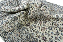 Surface texture of 2000s Kashan rug with natural Wool and intricate pattern