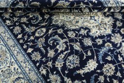 Close-up detail of 2000s Nain rug from Iran / Persia showing Wool weave