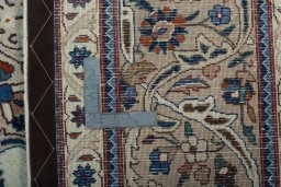 Backside of handmade 2000s Kashmar rug showing knot structure and weave density