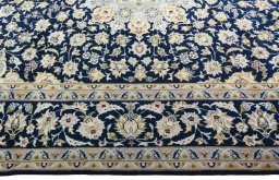 Corner detail of 2000s Najafabad rug showing border pattern and Wool pile