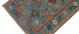 Backside of handmade New Kazak rug showing knot structure and weave density