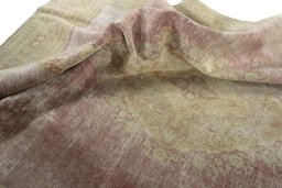Surface texture of 1950s Vintage rug with natural Wool and intricate pattern