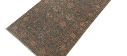 Backside of handmade New Farahan rug showing knot structure and weave density