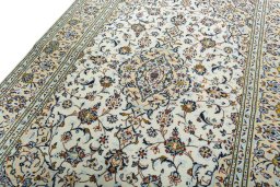 Backside of handmade 2000s Kashan rug showing knot structure and weave density