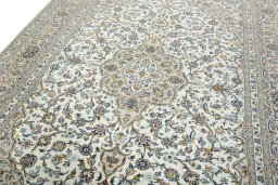 Backside of handmade 2000s Kashan rug showing knot structure and weave density