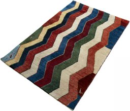 Corner detail of 2000s Persian Gabbeh rug showing border pattern and Wool pile