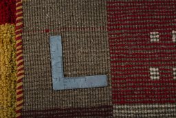 Close-up detail of 2000s Persian Gabbeh rug from Pakistan showing Wool weave