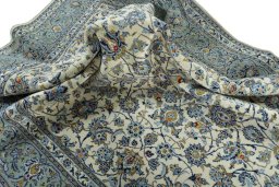 Surface texture of 2000s Kashan rug with natural Wool and intricate pattern