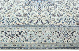 Corner detail of 2000s Nain rug showing border pattern and Wool pile