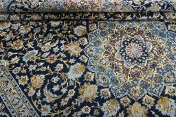 Close-up detail of 2000s Kashan rug from Iran / Persia showing Wool weave