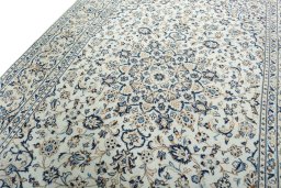 Backside of handmade 2000s Kashan rug showing knot structure and weave density