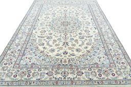 Surface texture of 2000s Nain rug with natural Wool and intricate pattern