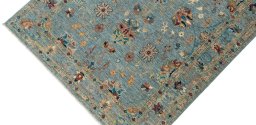 Backside of handmade New Farahan rug showing knot structure and weave density