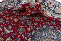 Surface texture of 2000s Najafabad rug with natural Wool and intricate pattern