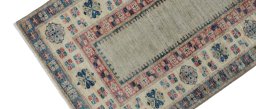 Backside of handmade New Kazak rug showing knot structure and weave density