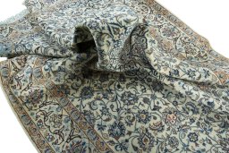 Surface texture of 2000s Nain rug with natural Wool and intricate pattern