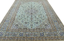Surface texture of 2000s Kashan rug with natural Wool and intricate pattern