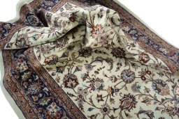 Surface texture of 2000s Mashad rug with natural Wool and intricate pattern