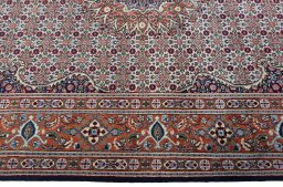 Corner detail of 2000s Moud rug showing border pattern and Wool pile