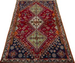 Surface texture of 2000s Shiraz rug with natural Wool and intricate pattern