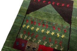 Backside of handmade 2000s Persian Gabbeh rug showing knot structure and weave density