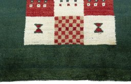 Central medallion detail of 2000s Persian Gabbeh rug from Pakistan
