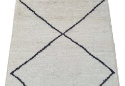Backside of handmade New Morocco rug showing knot structure and weave density