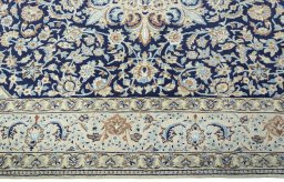 Corner detail of 2000s Nain rug showing border pattern and Wool pile