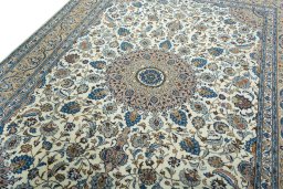 Backside of handmade 2000s Kashmar rug showing knot structure and weave density