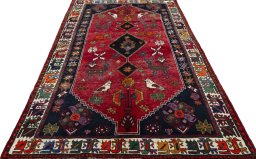 Surface texture of 2000s Shiraz rug with natural Wool and intricate pattern