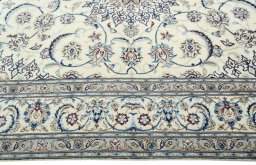 Corner detail of 2000s Nain rug showing border pattern and Wool pile