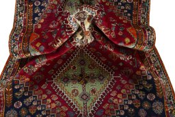 Corner detail of 2000s Shiraz rug showing border pattern and Wool pile