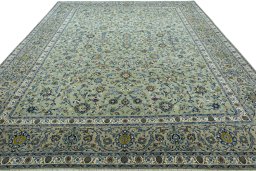 Surface texture of 2000s Kashan rug with natural Wool and intricate pattern