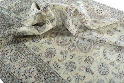 Surface texture of 2000s Nain rug with natural Wool and intricate pattern