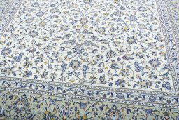 Close-up detail of 2000s Kashan rug from Iran / Persia showing Wool weave