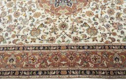 Corner detail of 2000s Tabriz 50/60/70 Raj rug showing border pattern and Cork pile
