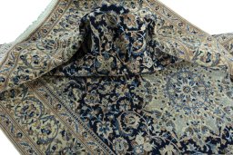 Surface texture of 2000s Nain rug with natural Wool and intricate pattern